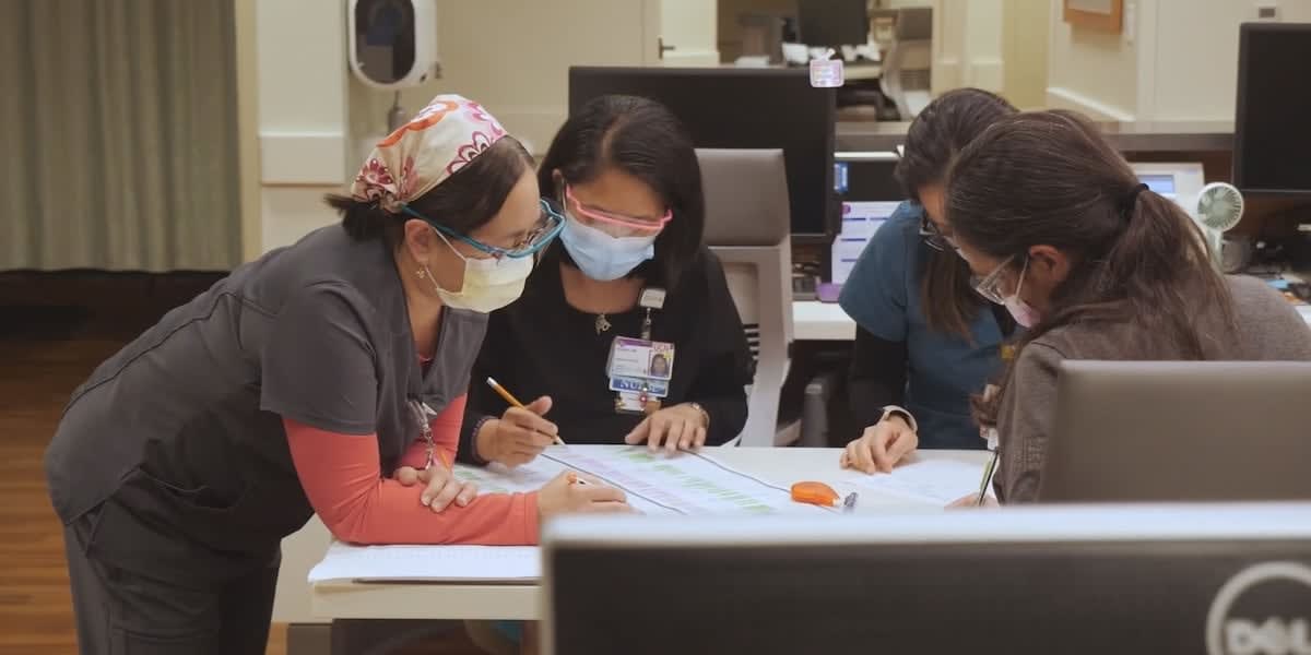 Oncology nurse navigator Noe McGuire providing compassionate support to cancer patient in Hawaii hospital