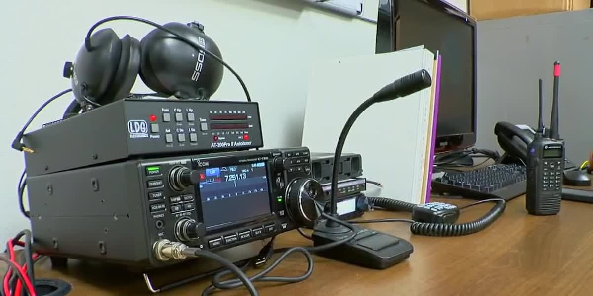 Ham radio operator volunteers testing emergency communication equipment at station in Texas