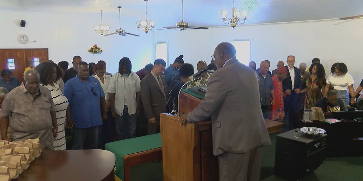 Family members gathered outside historic County Line Baptist Church in Geneva, Texas for annual Juneteenth celebration
