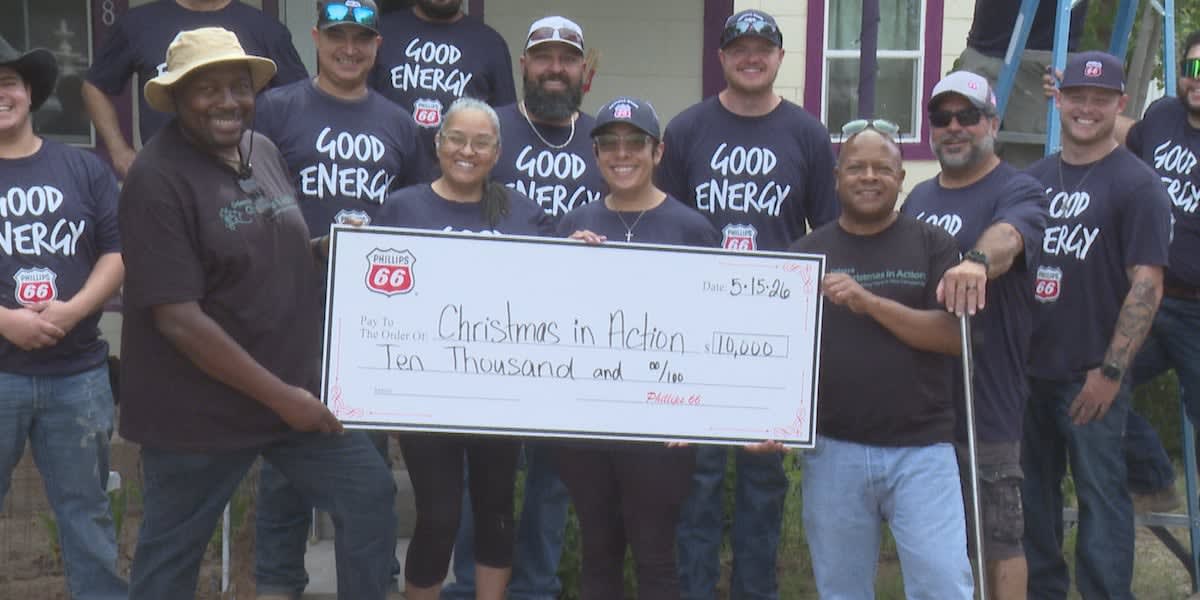 Phillips 66 volunteers painting exterior of home for elderly Odessa resident through Christmas in Action nonprofit