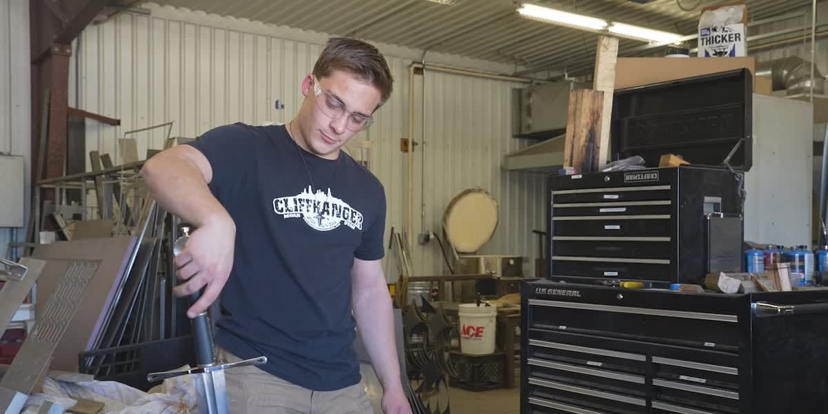 Metallurgical engineering student Caleb Oppelt receives large scholarship check at South Dakota Mines ceremony