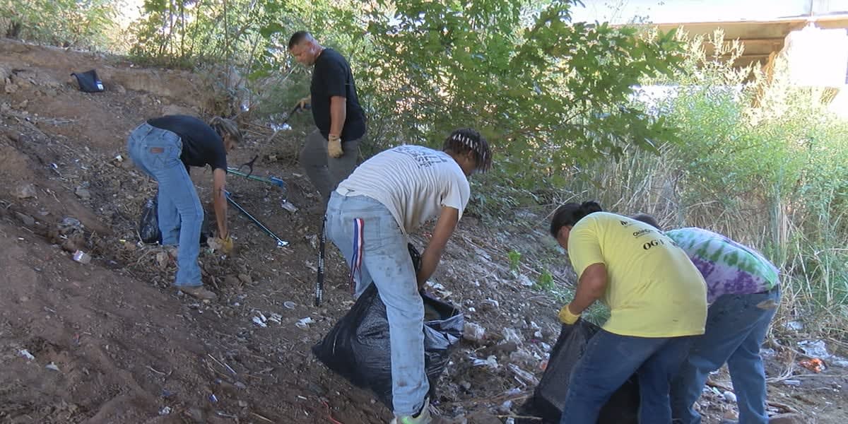 Volunteers cleaning creek banks and picking up trash along Numu Creek in Lawton, Oklahoma