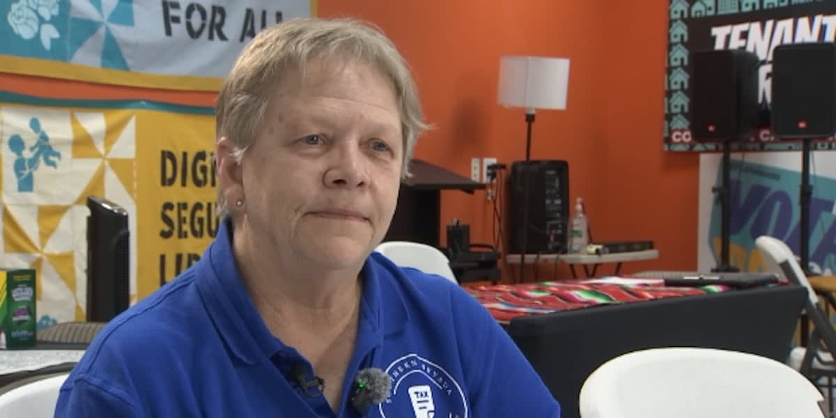 Volunteer helping family with tax paperwork at community event in Las Vegas