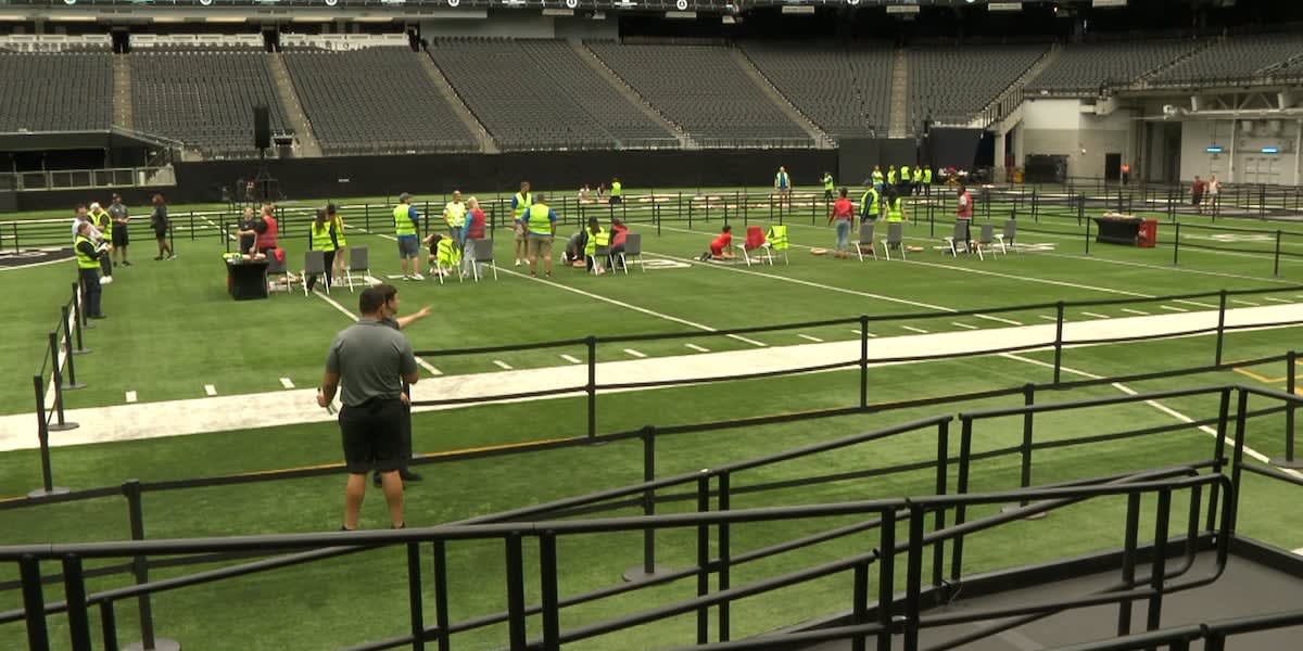 Las Vegas Raiders fans learning hands-only CPR techniques at training facility world record event