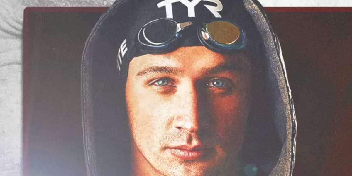 Ryan Lochte smiling in coaching attire on pool deck at Missouri State University