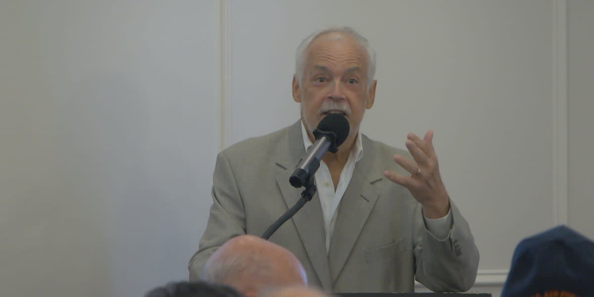 Jay Grymes speaking at podium during National Cancer Survivor Day luncheon in Baton Rouge
