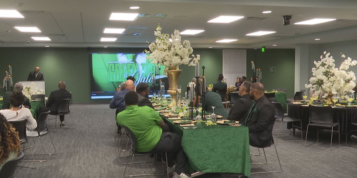 Former Vigor High School football players and coaches gathering at formal Green Tie Gala event