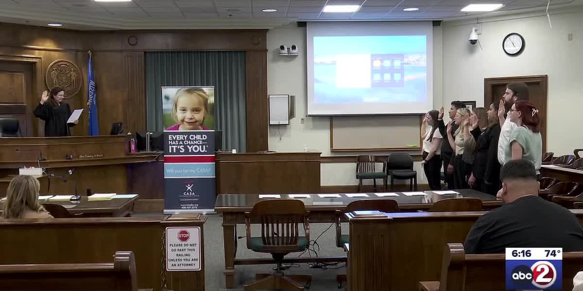 Seven volunteers taking oath at CASA of Brown County swearing-in ceremony for child advocates