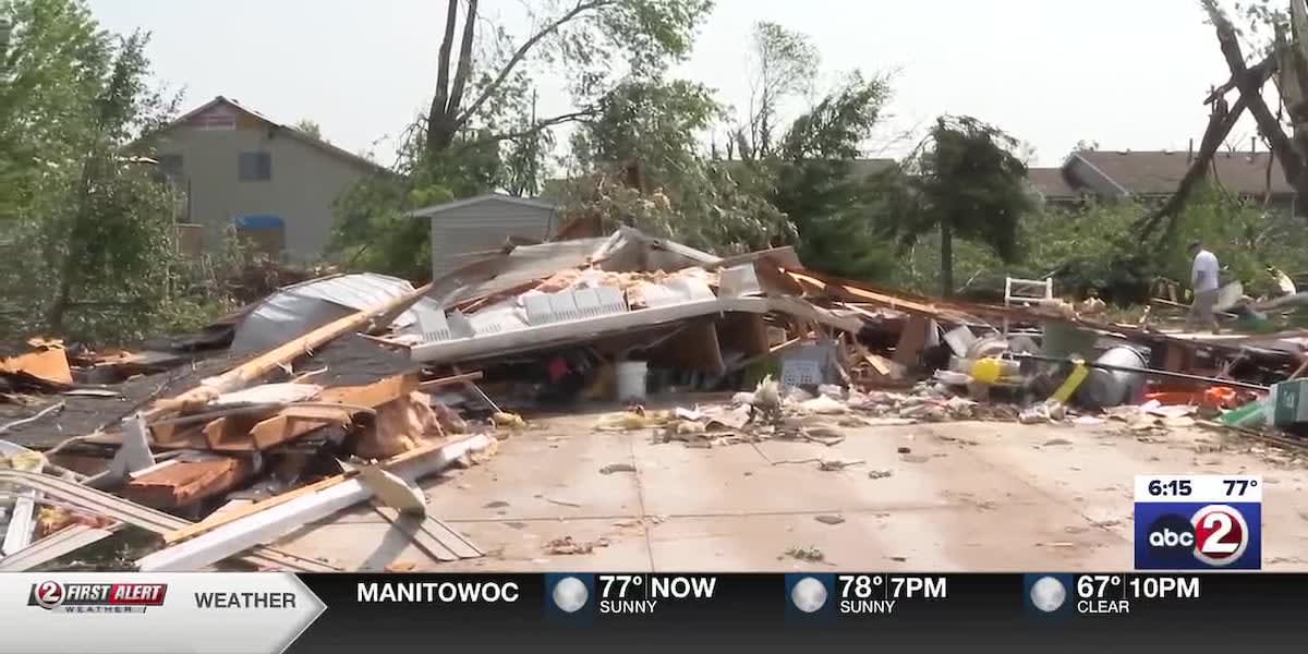 Volunteers working together to clean up park debris after tornado in Menasha Wisconsin