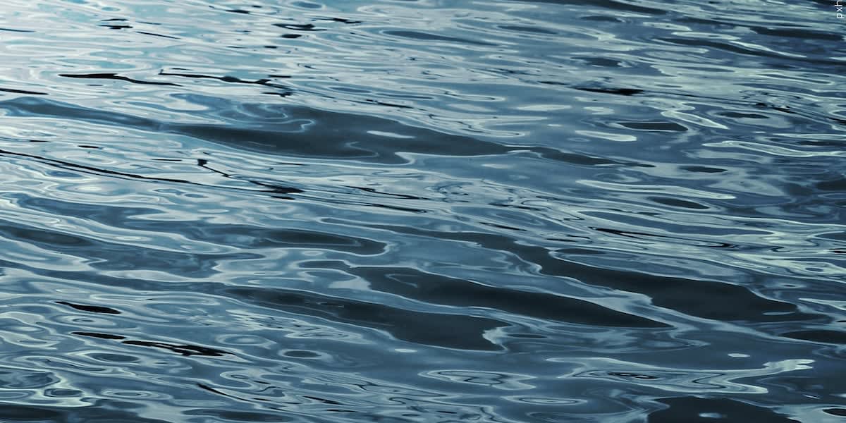 ** First responders conducting water rescue operations on lake during severe storm conditions