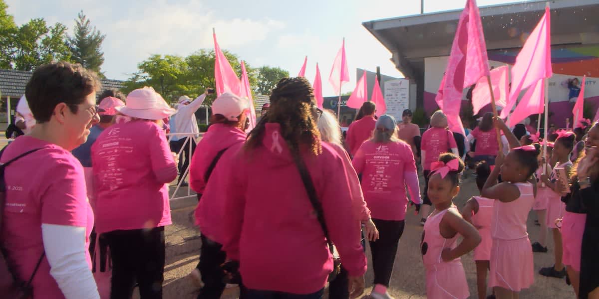 Crowd wearing pink gathered at Peoria Metro Centre for breast cancer awareness walk