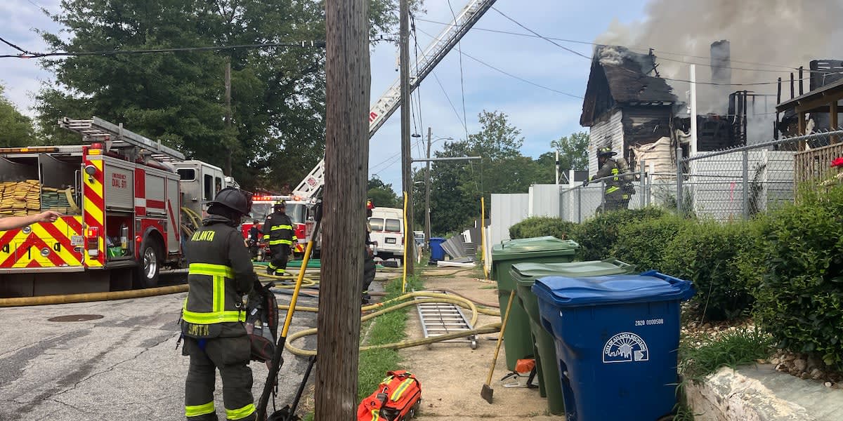 Atlanta Fire Rescue crews working at house fire scene where animals were rescued
