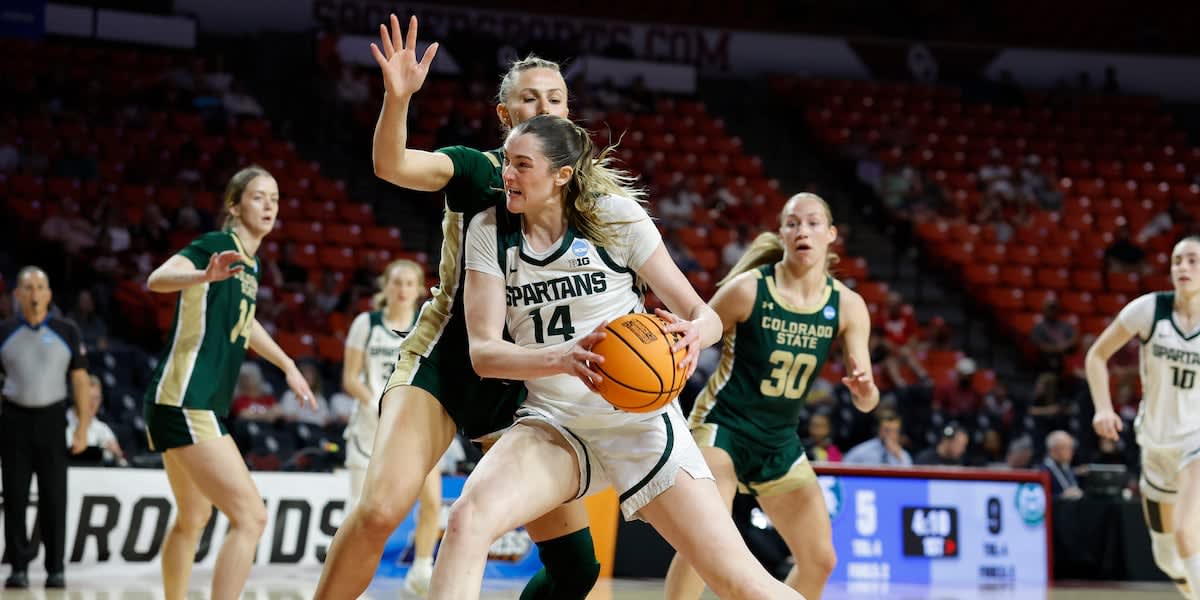 Michigan State basketball player Grace VanSlooten drives to basket during NCAA Tournament game