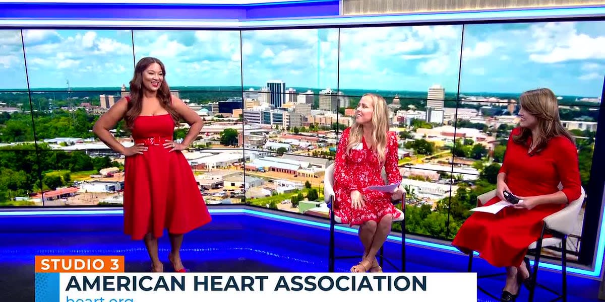 Heart disease survivors walking confidently on runway during fashion show preview in television studio