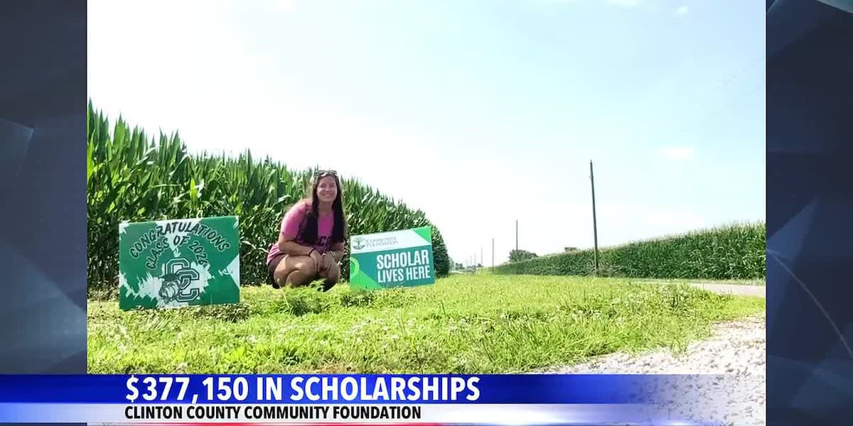 Happy college students celebrating with scholarship award letters in Clinton County, Indiana