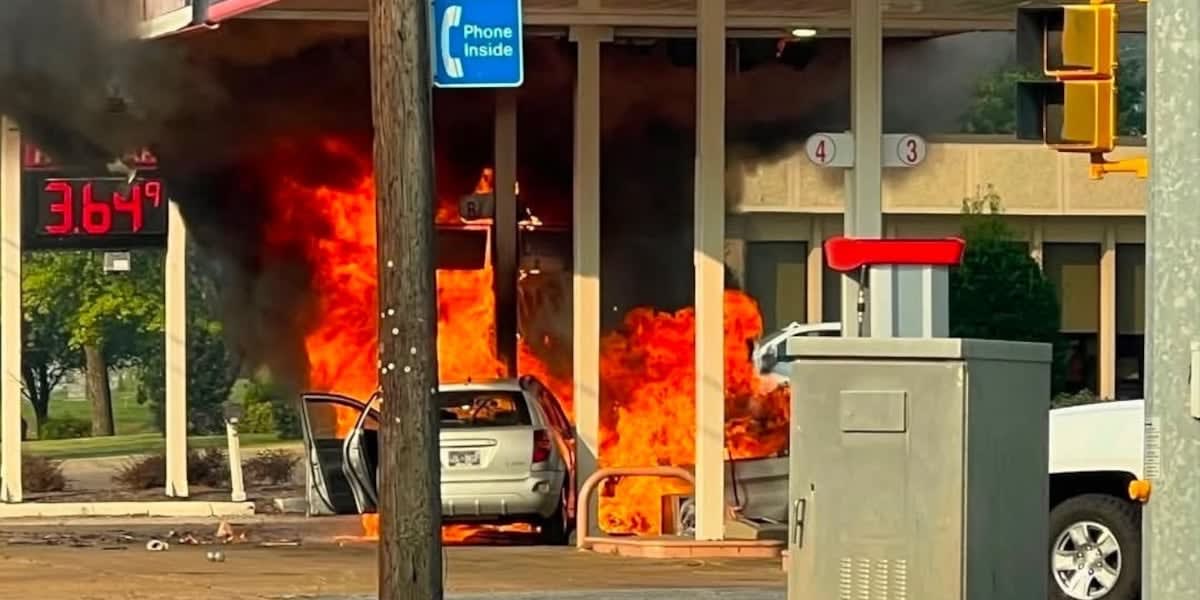 Burned vehicle at gas station with damaged pumps and canopy after Tennessee rescue