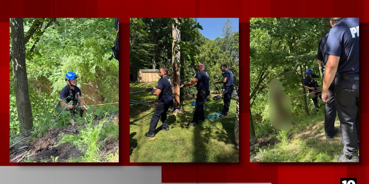Parma firefighters performing rope rescue operation in steep ravine to save fallen homeowner