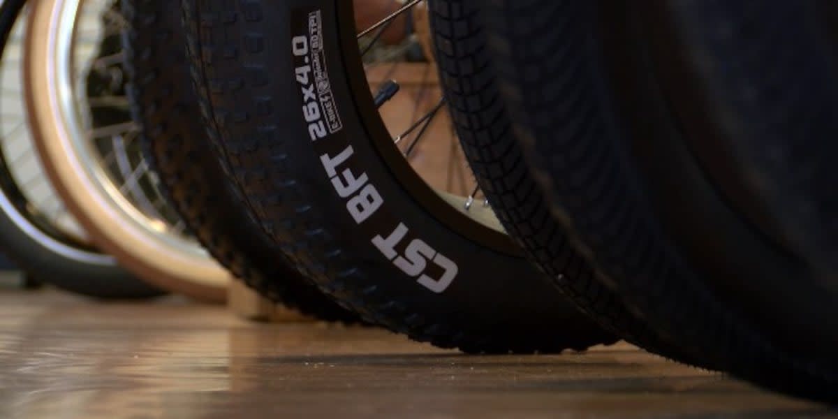 Modern e-bike assembly facility with workers in bright manufacturing space in Tennessee