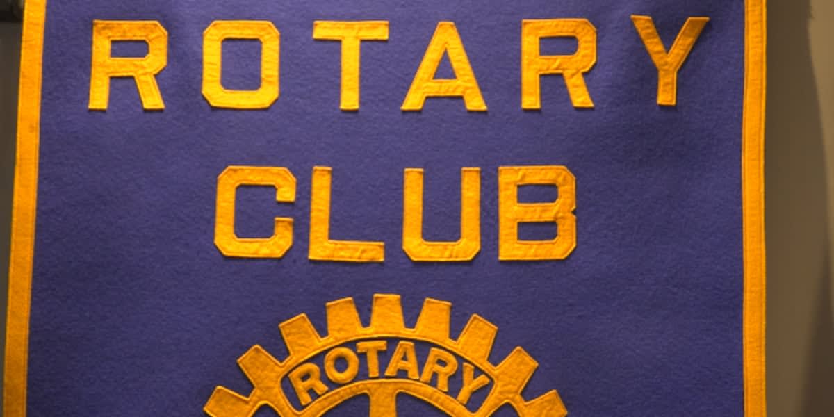 Rotary Club members presenting gift cards to community members in Belpre, Ohio