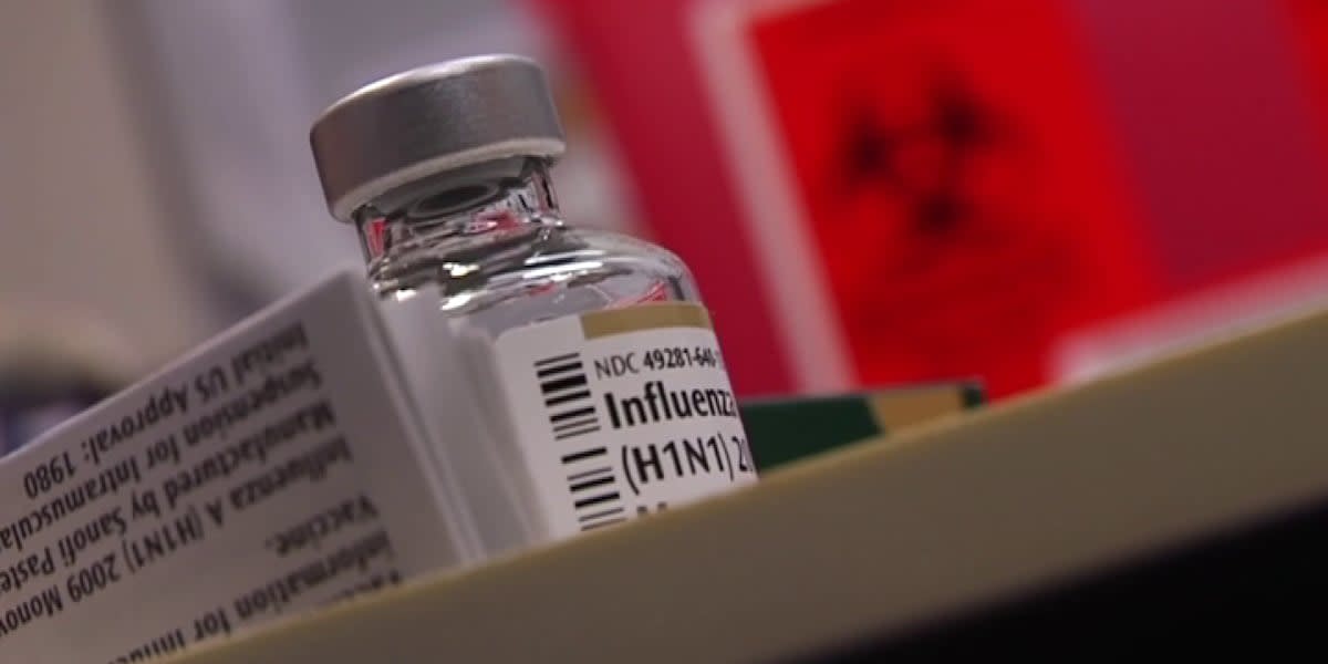 Healthcare worker preparing flu vaccine shot at community vaccination clinic in Vincennes, Indiana