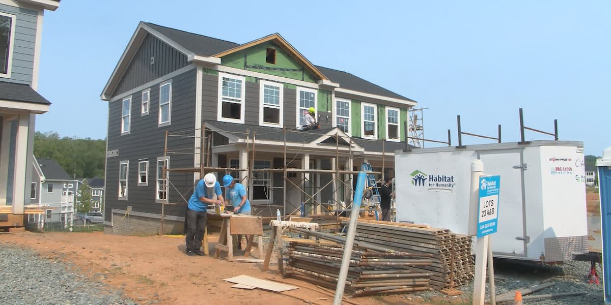 Future homeowners and volunteer builders frame walls at Southwood affordable housing construction site in Charlottesville