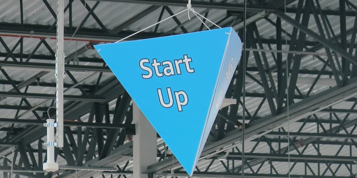Amazon distribution center exterior in southern West Virginia with workers entering facility