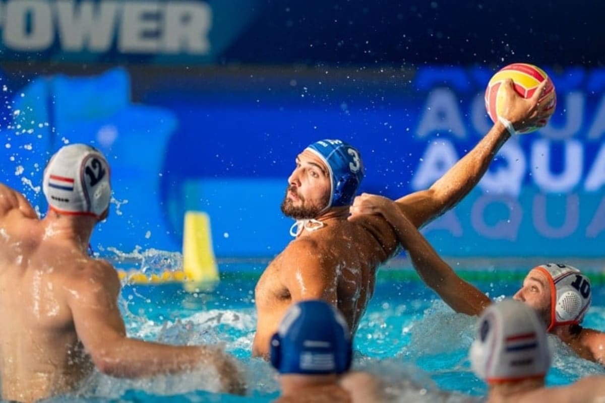 Greek water polo players celebrating their World Cup Final Four qualification victory