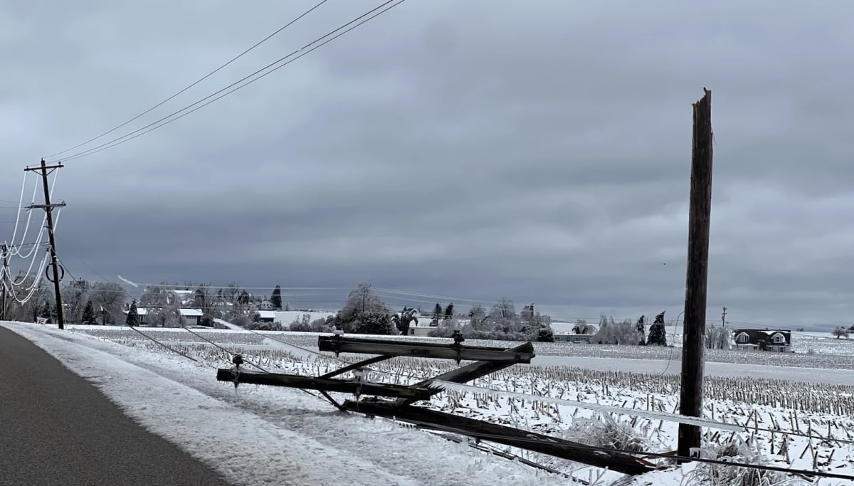 Power line workers installing underground electrical cables in northern Michigan neighborhood