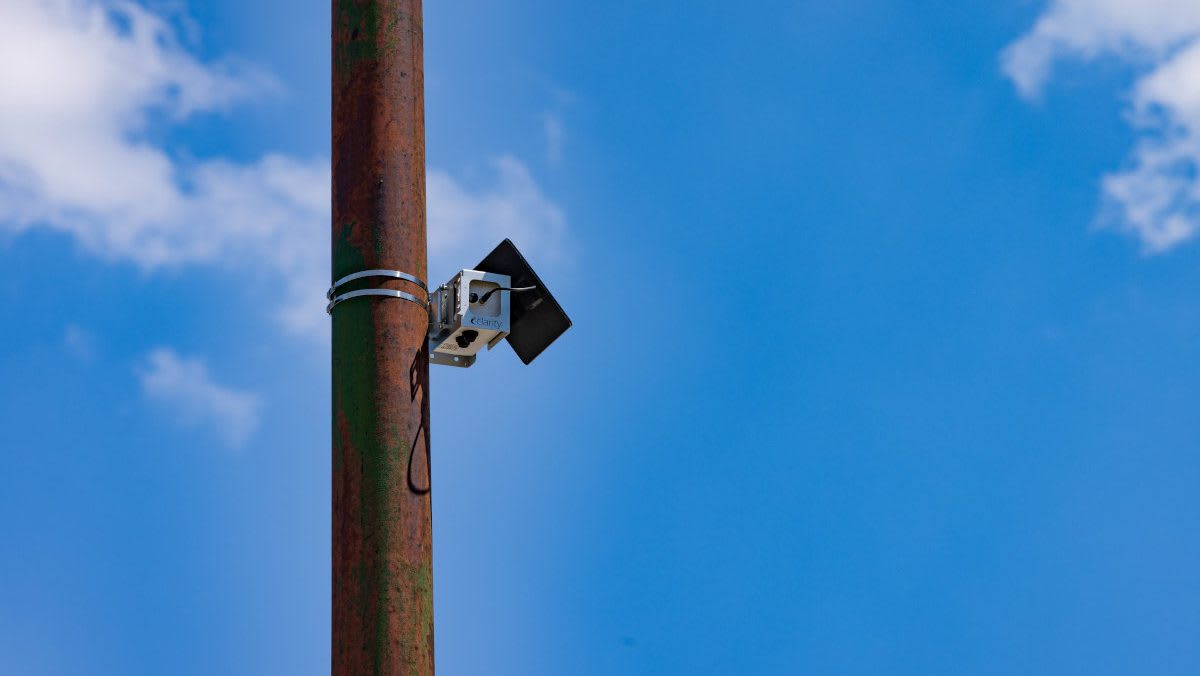 Solar-powered air quality monitor mounted on light pole in Chicago's Grant Park