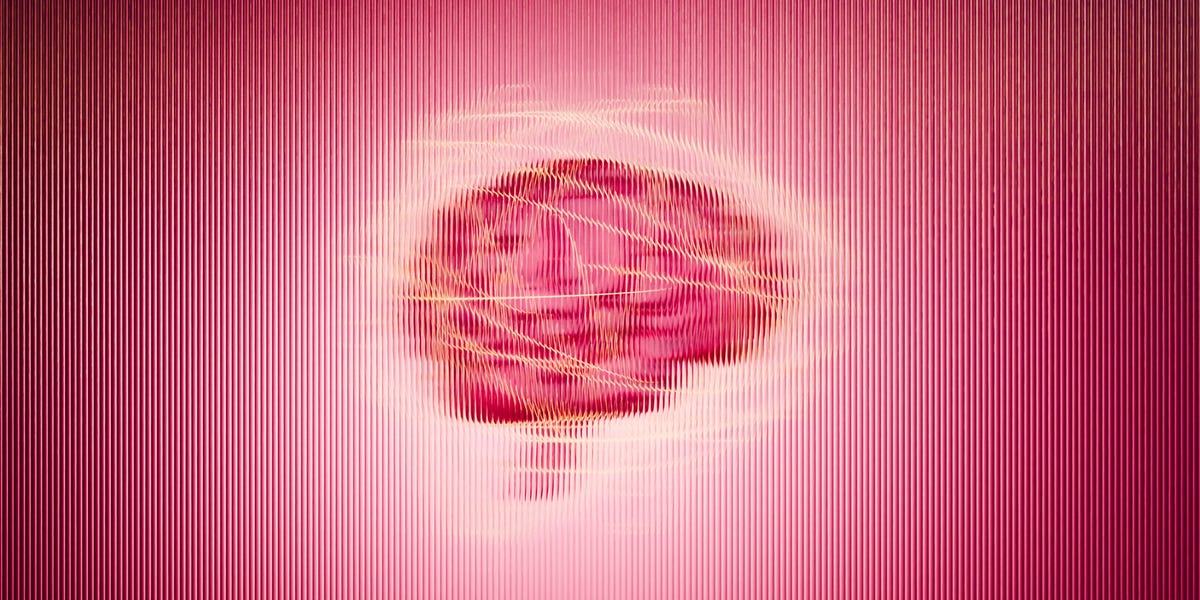 Female scientist examining brain scans in research laboratory focused on women's cognitive health
