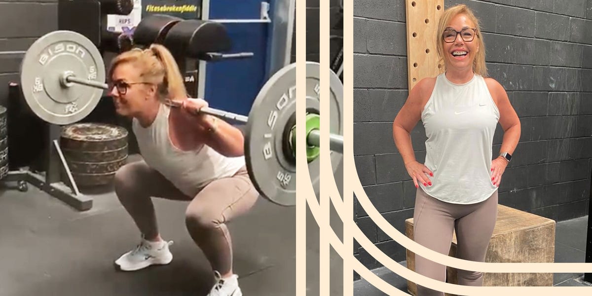 Smiling 67 year old woman performing deadlift with barbell at gym