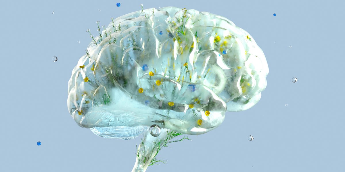 Person cycling on stationary bike with brain illustration showing neural connections glowing brightly