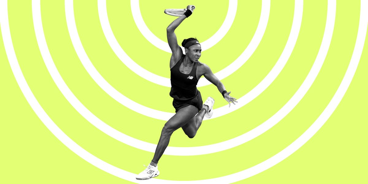 Tennis champion Coco Gauff holding racket on court during professional match