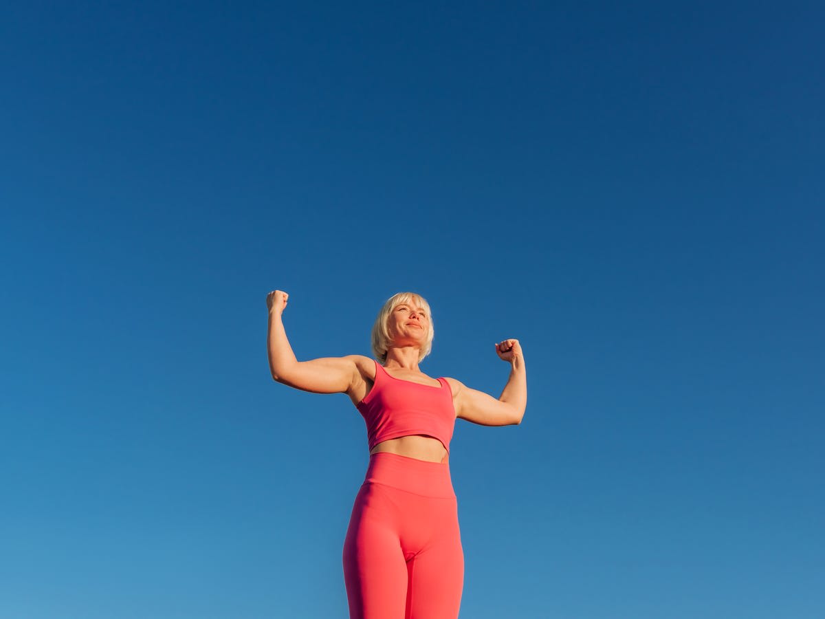 Woman performing calisthenics exercise in gym showing proper progressive overload technique