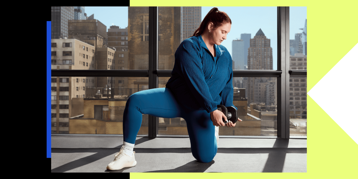 Woman performing core strengthening exercise on yoga mat with dumbbells nearby