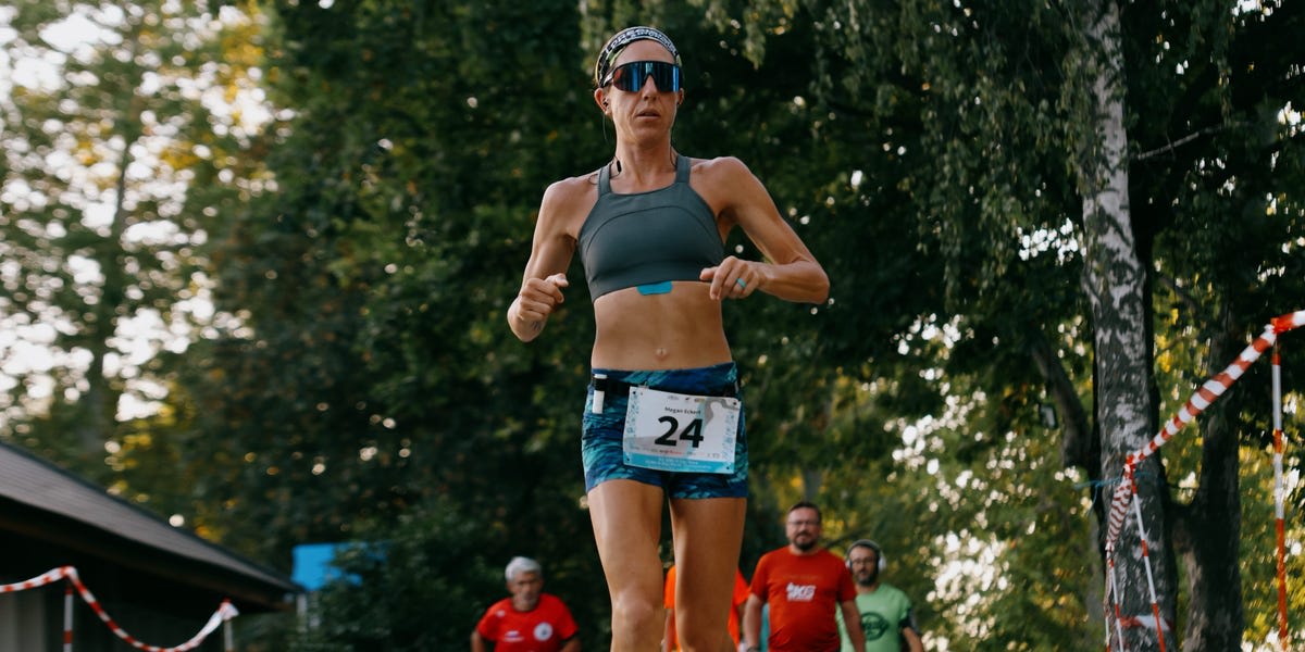 Middle school teacher Megan Eckert running on outdoor track at ultramarathon world championship event