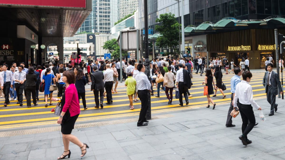 Hong Kong city skyline with busy business district showing economic activity and employment growth