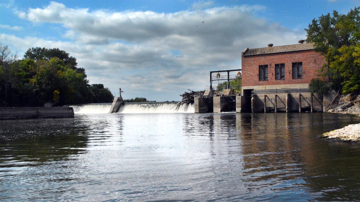 Community members gathered at outdoor fundraiser event for historic Rutland Dam in Iowa