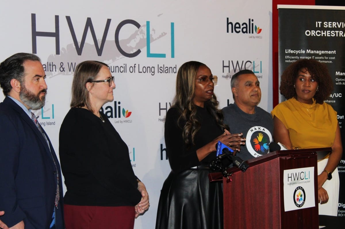 Person using laptop to search for jobs on Long Island employment platform website