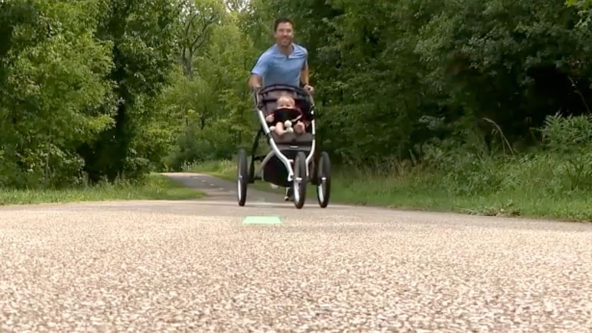 Emergency room doctor Stephen Biebelhausen running while pushing baby daughter Blake in racing stroller