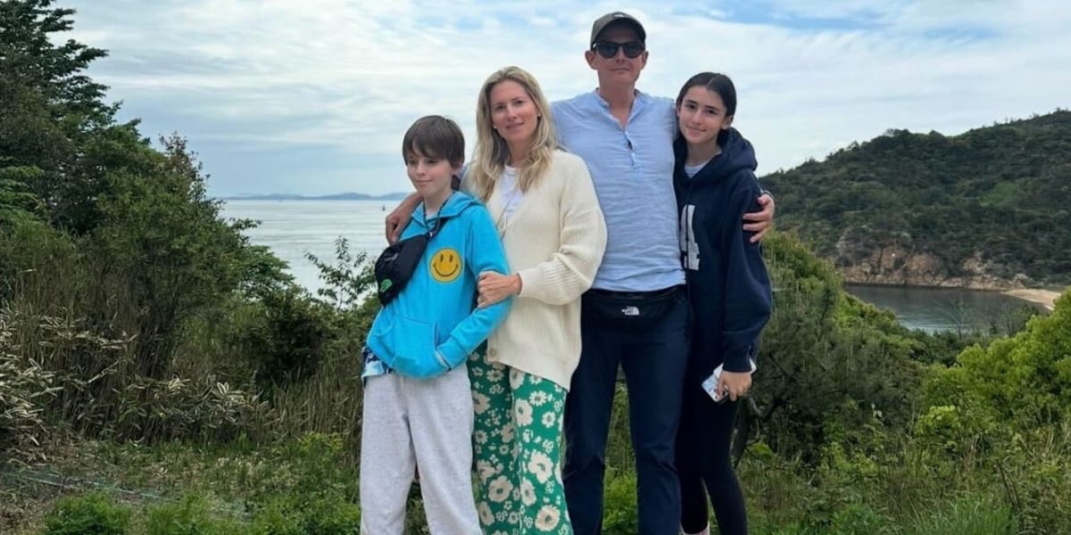 Marina and Ricardo Larroudé, cofounders of successful shoe company, standing together smiling