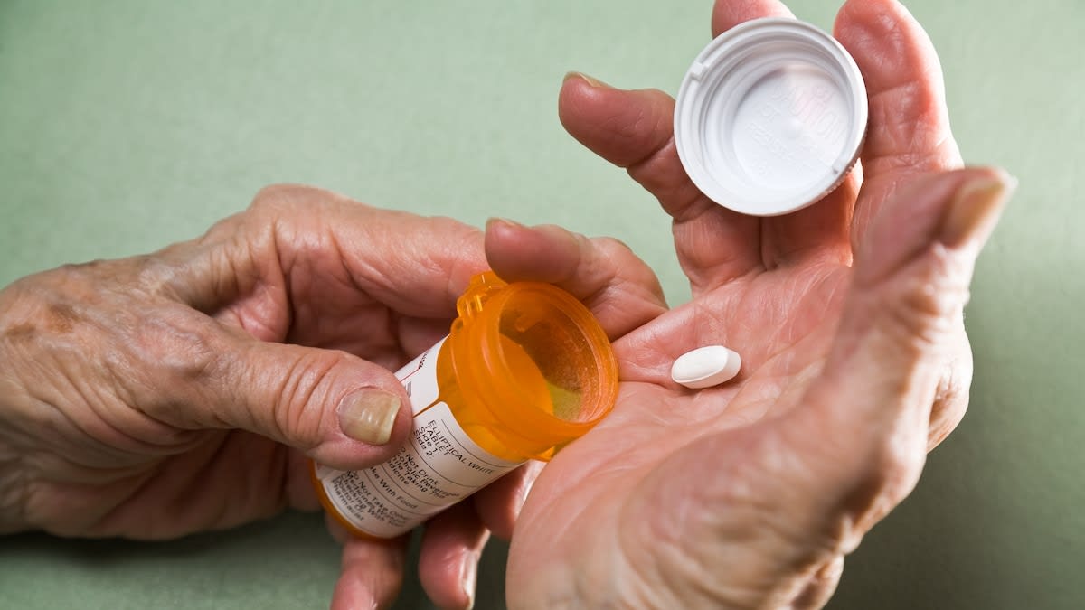 Fluorescence microscope image showing blue-stained pancreatic cancer cell nuclei in spherical cluster