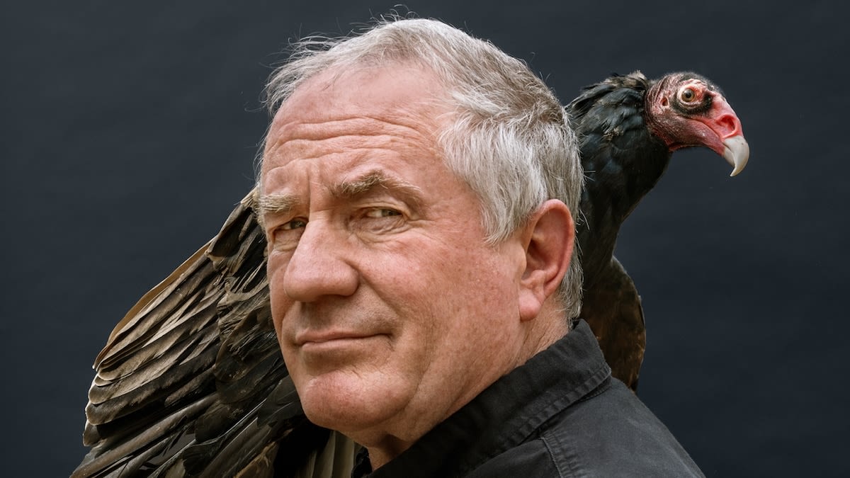 Wildlife photographer Joel Sartore with camera equipment photographing animals for conservation project Photo Ark