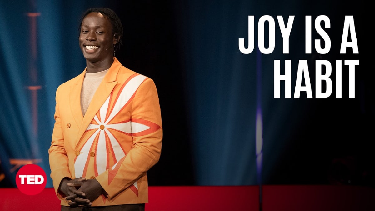 ** Poet David Larbi performing on the TED stage during his talk about finding everyday joy