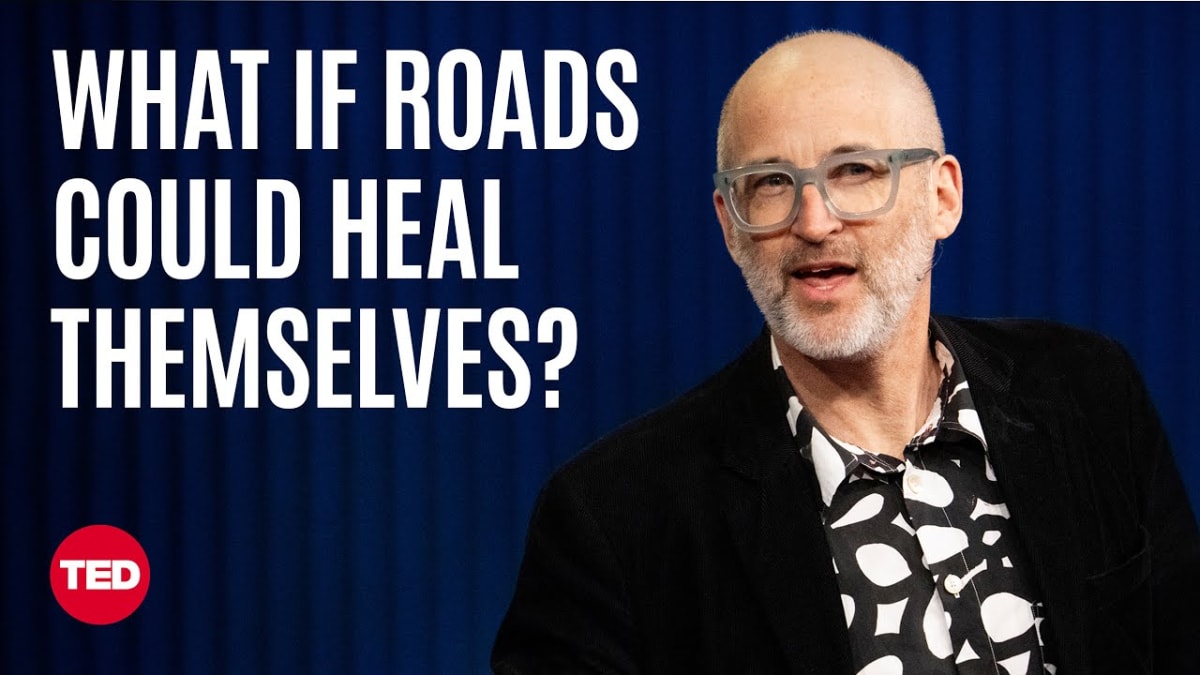 ** Scientist examining innovative self-healing construction material that could repair damaged roads and bridges automatically