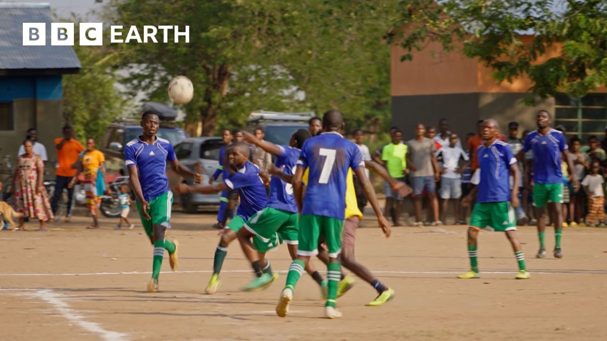 Soccer players in Zambia perform educational wildlife conservation skit during halftime match