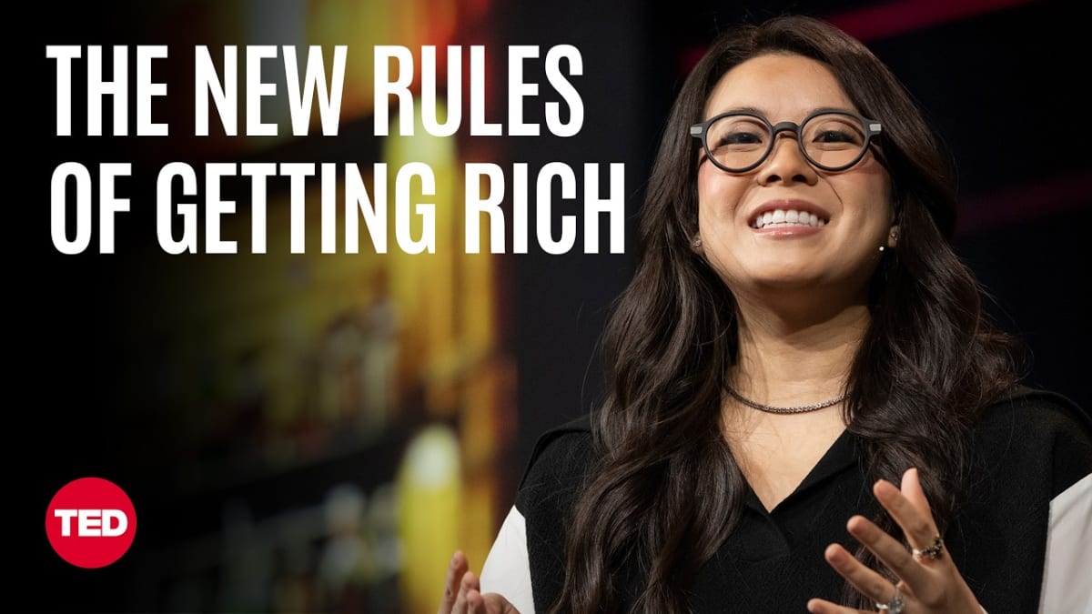 ** Vivian Tu speaking on TED stage about financial education and breaking free from living paycheck to paycheck