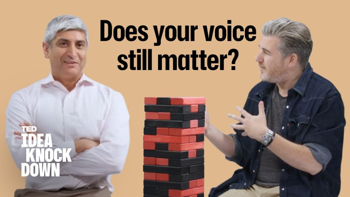 ** Two speakers in conversation on TED stage discussing democracy and political engagement