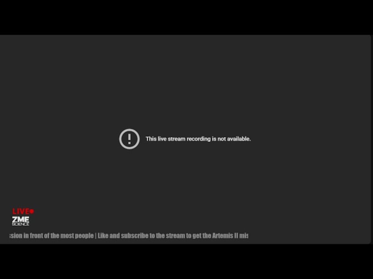 ** Four Artemis 2 astronauts in flight suits waving after successful Moon mission splashdown