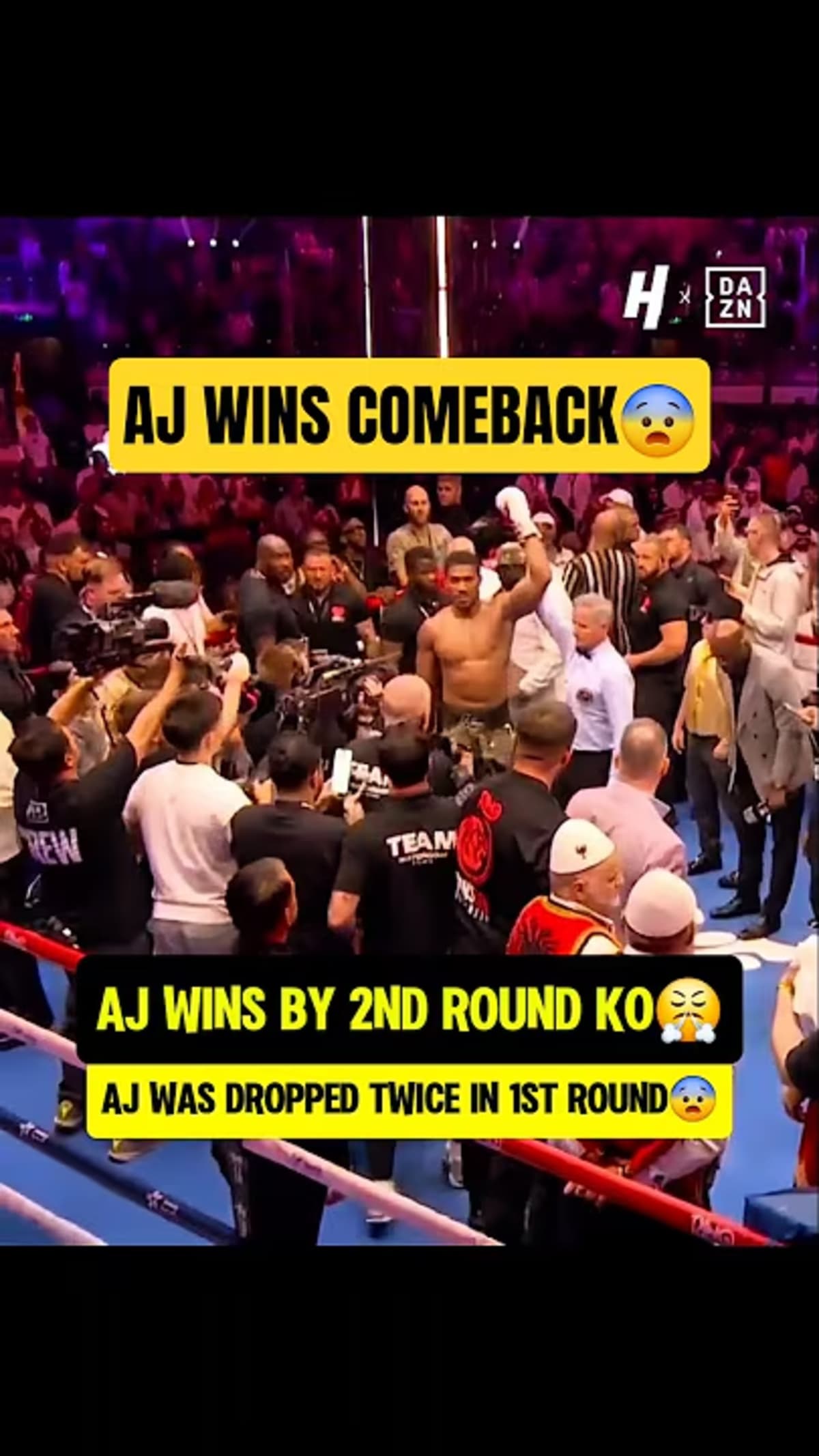Boxer Anthony Joshua standing victorious in the ring after comeback knockout win